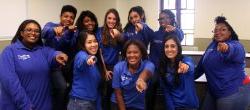 Group of students dressed in IT Service Desk blue shirt