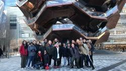 group in NYC outside architectural building